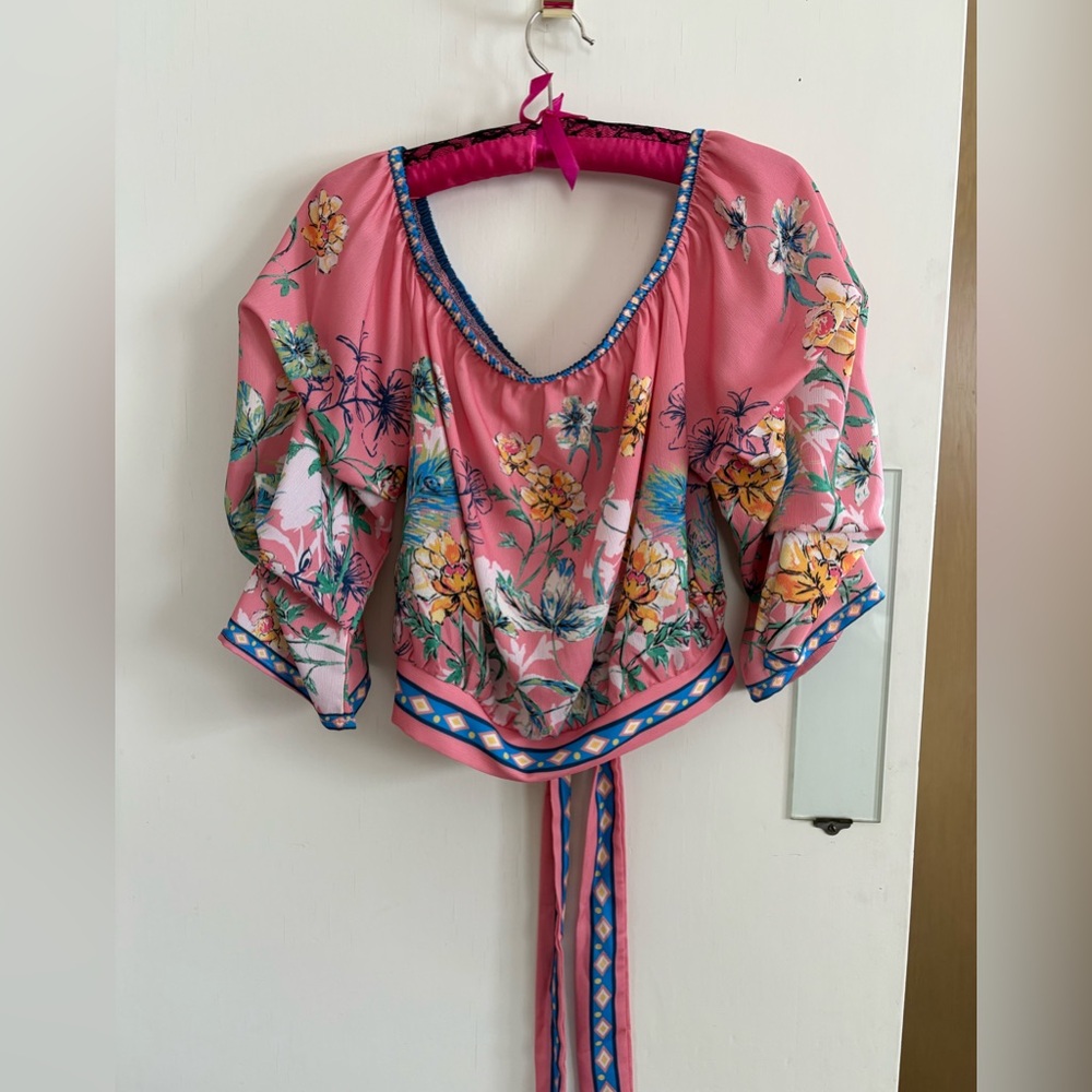 Crepe waist length blouse with tie back, ruched sleeve and open neck